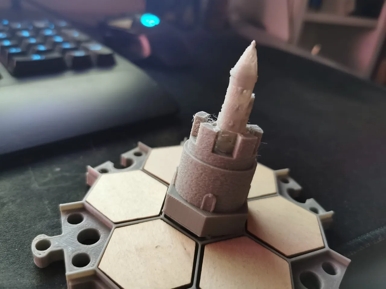 3D-printed fairy-tale town on laser-cut wooden hex tiles